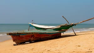 Un naufrago e i buoni propositi - barca sulla spiaggia del senegal immagine creata con l'IA